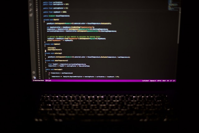 A dark picture of a screen with code on it