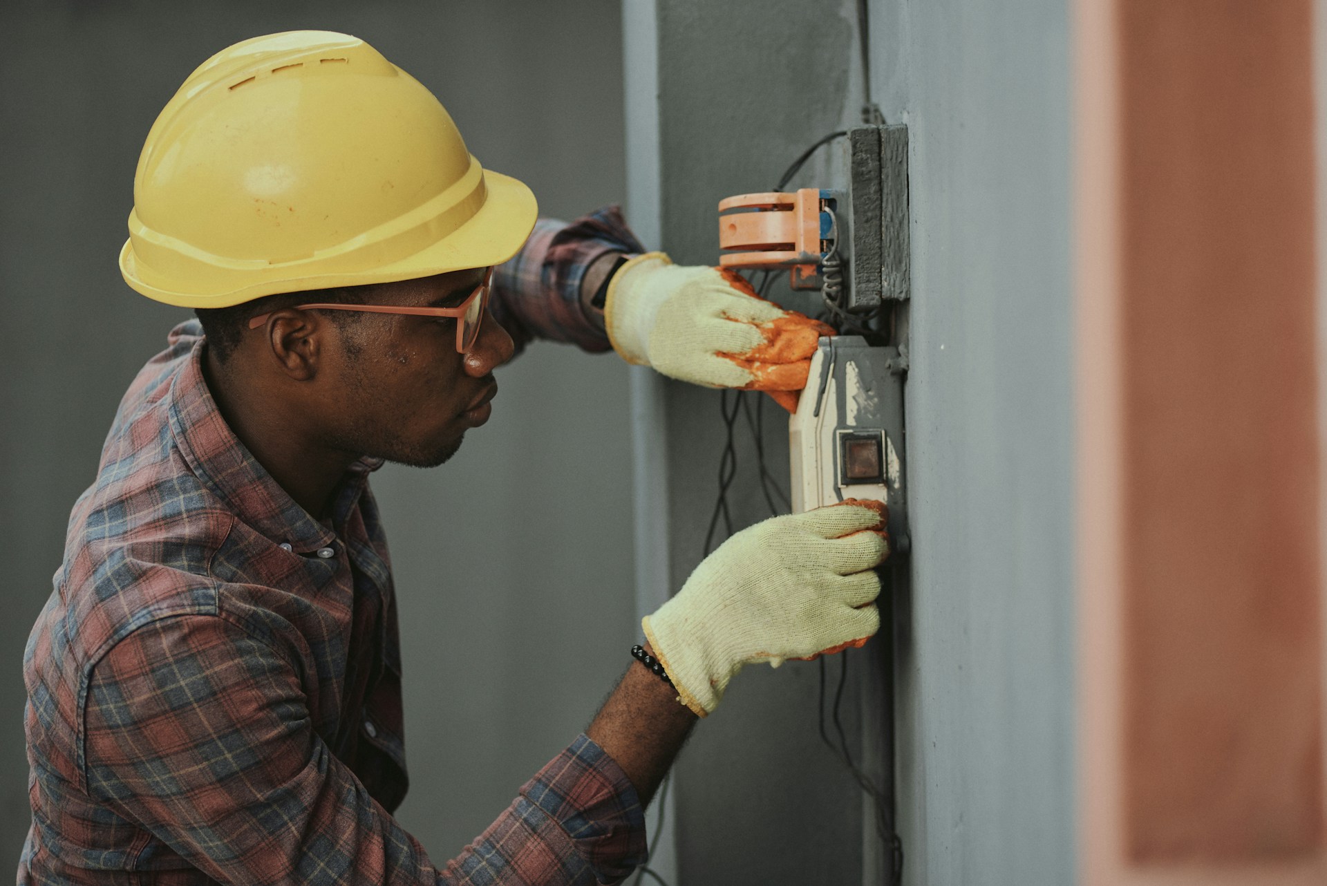An image of an electrician at work